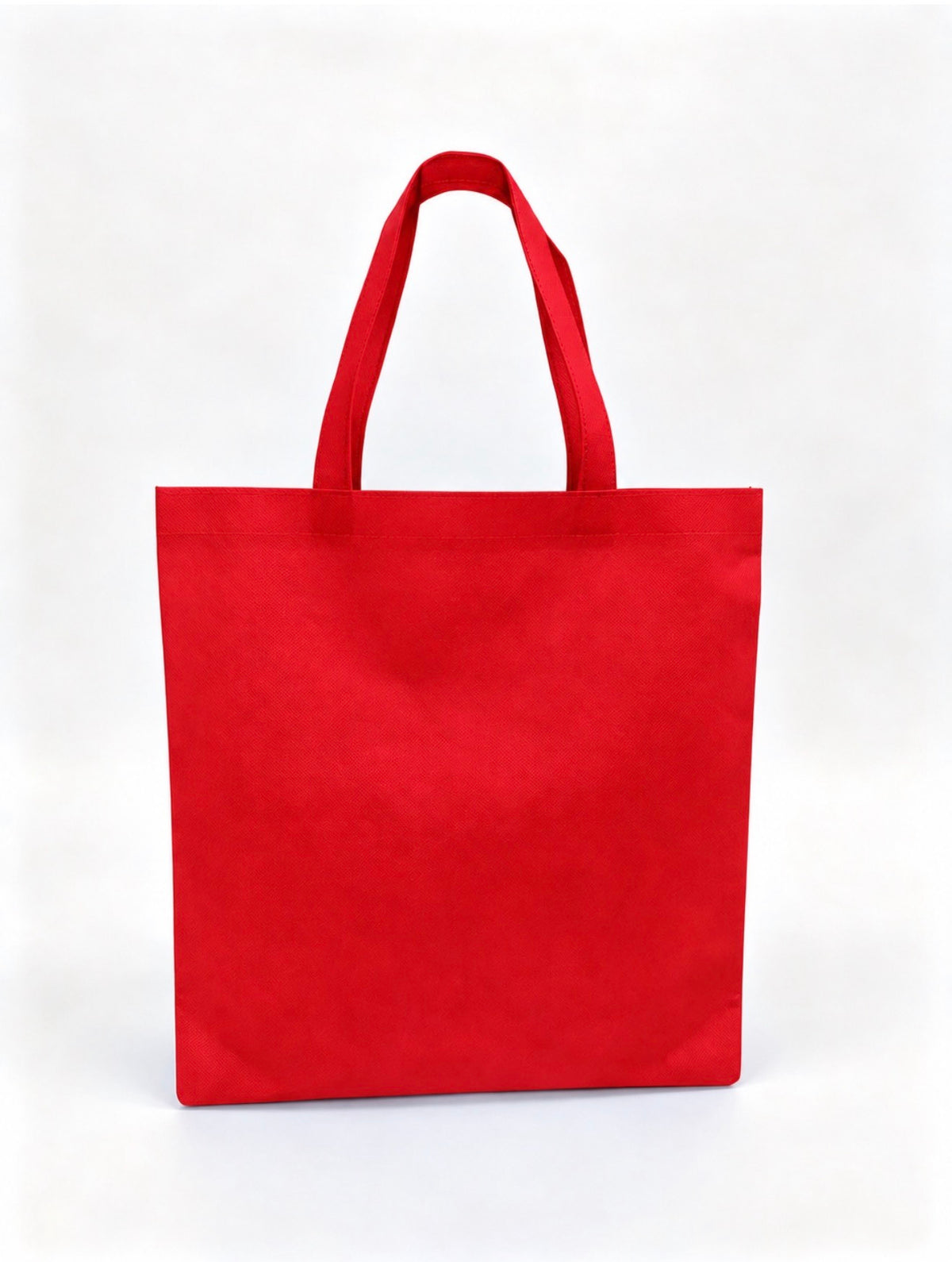 Plain red non-woven tote bag with long handles, 15 × 16 inches